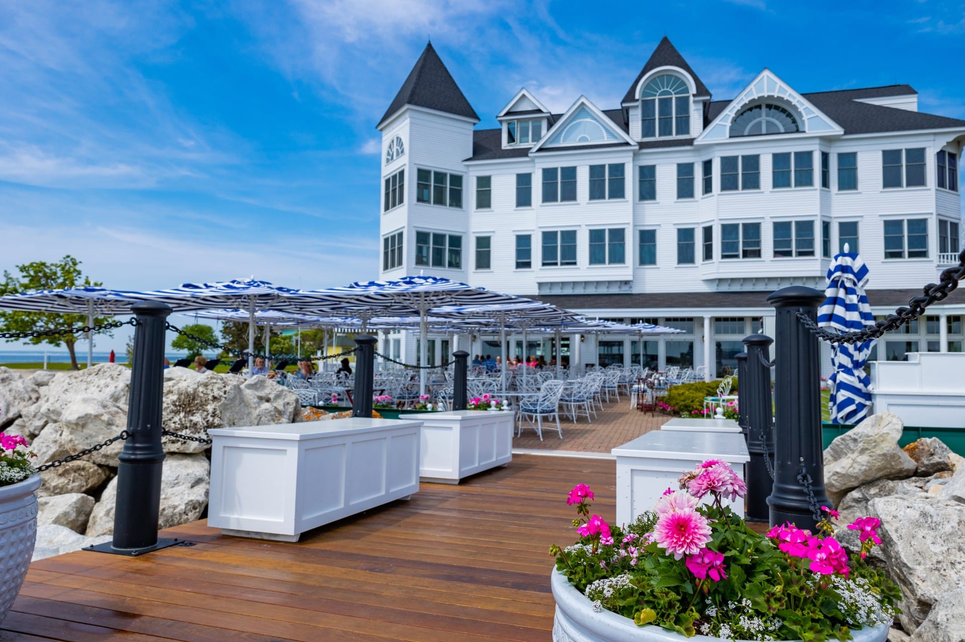 A view of the backside of Hotel Iroquois showcasing the deck and seating areas.