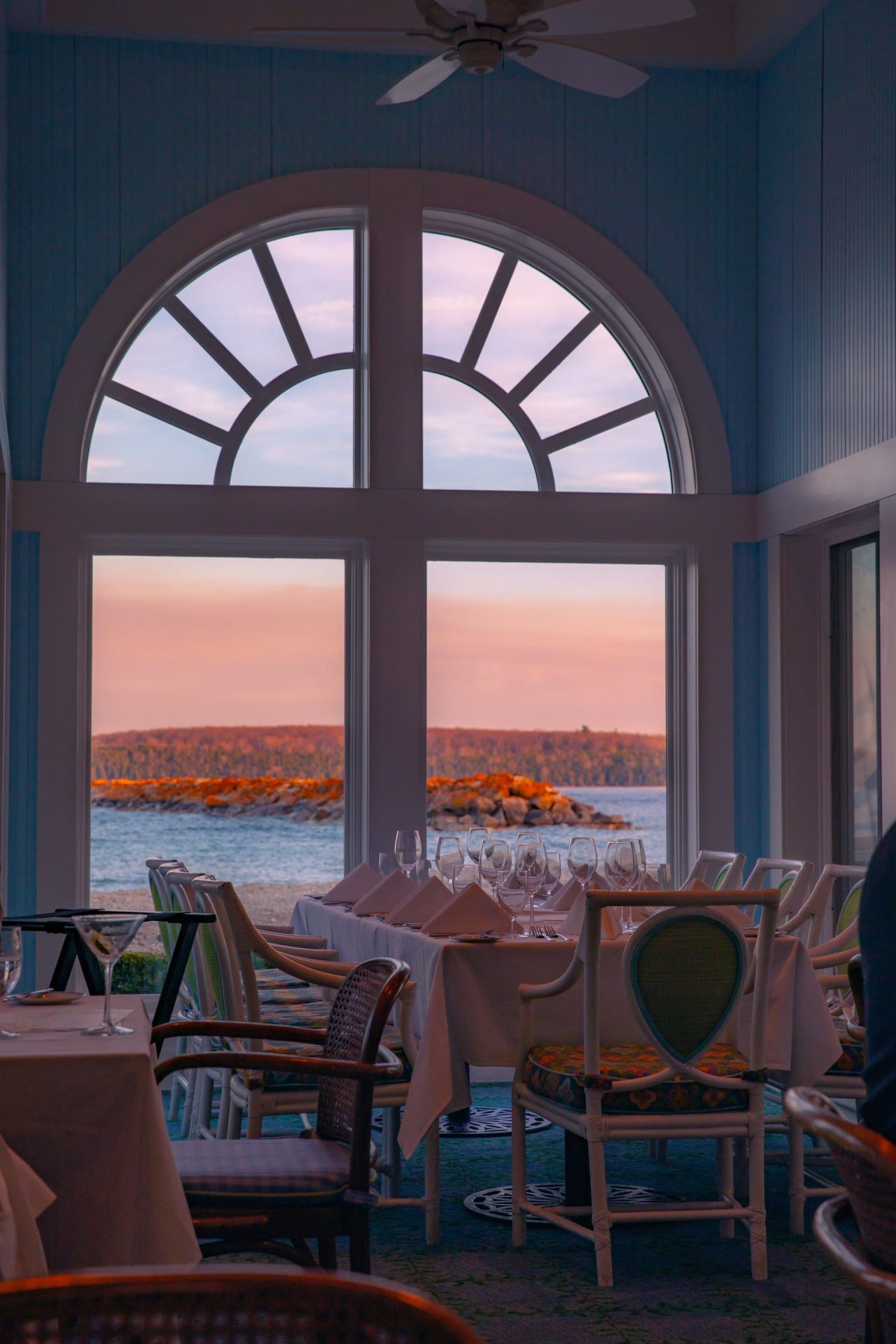 A sunset view through a window from the restaurant dining of Hotel Iroquois