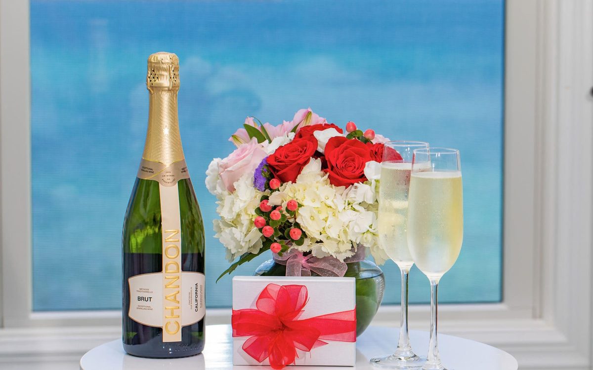Champagne, flour, and chocolates on a dish.