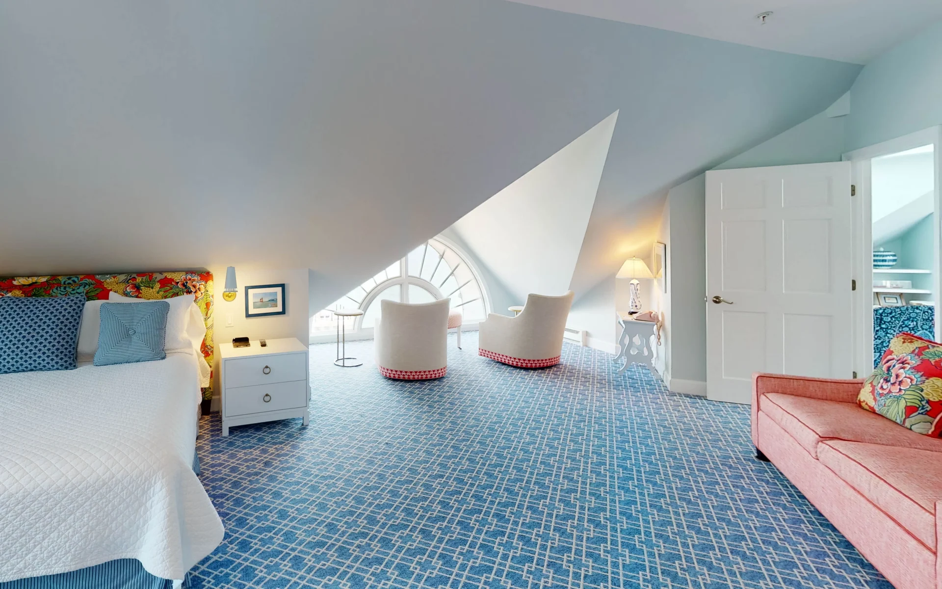 Blue room with blue walls and white bed.