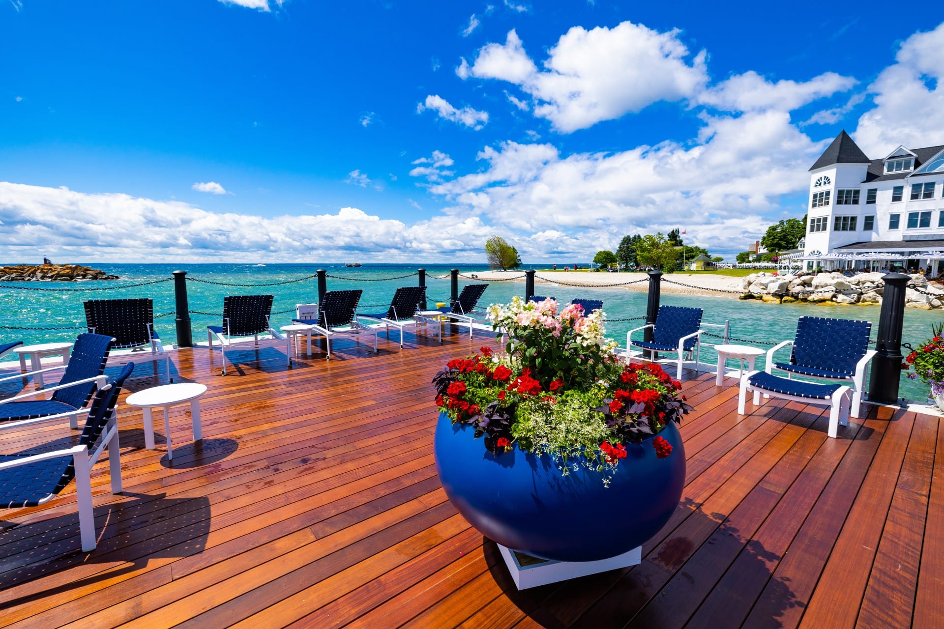 Outdoor seating on a pier at the backside of Hotel Iroquois on a cove in Lake Michigan.
