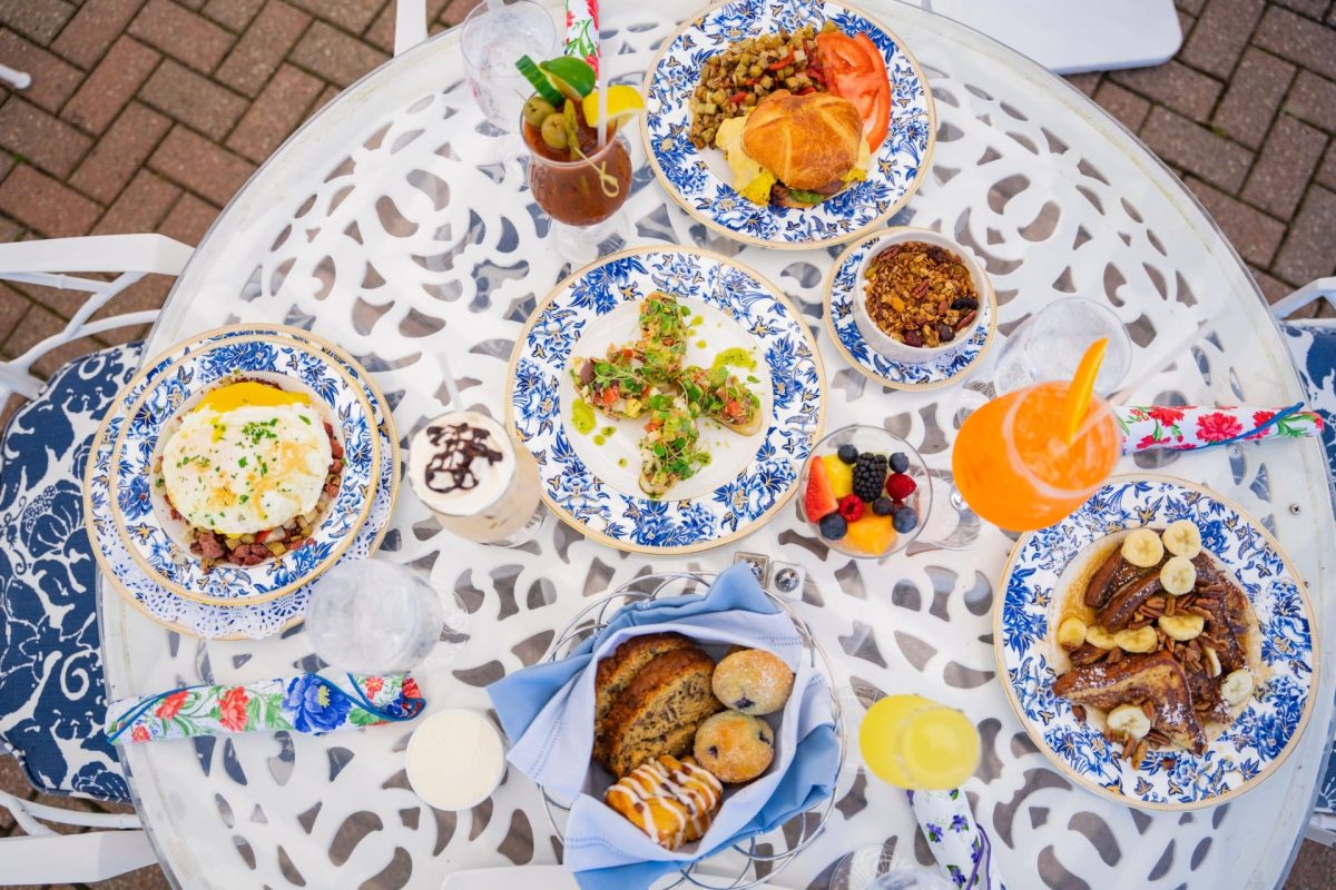 And assortment of food and drinks on a white table.