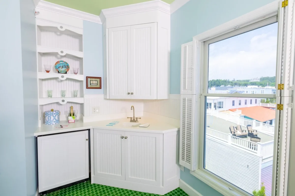 A kitchenette and a hotel room