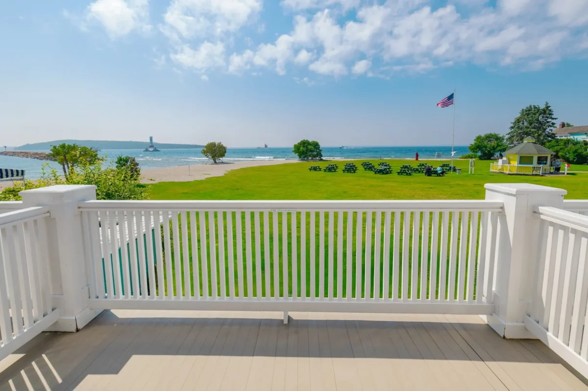 balcony looking out onto grass and lake superior.