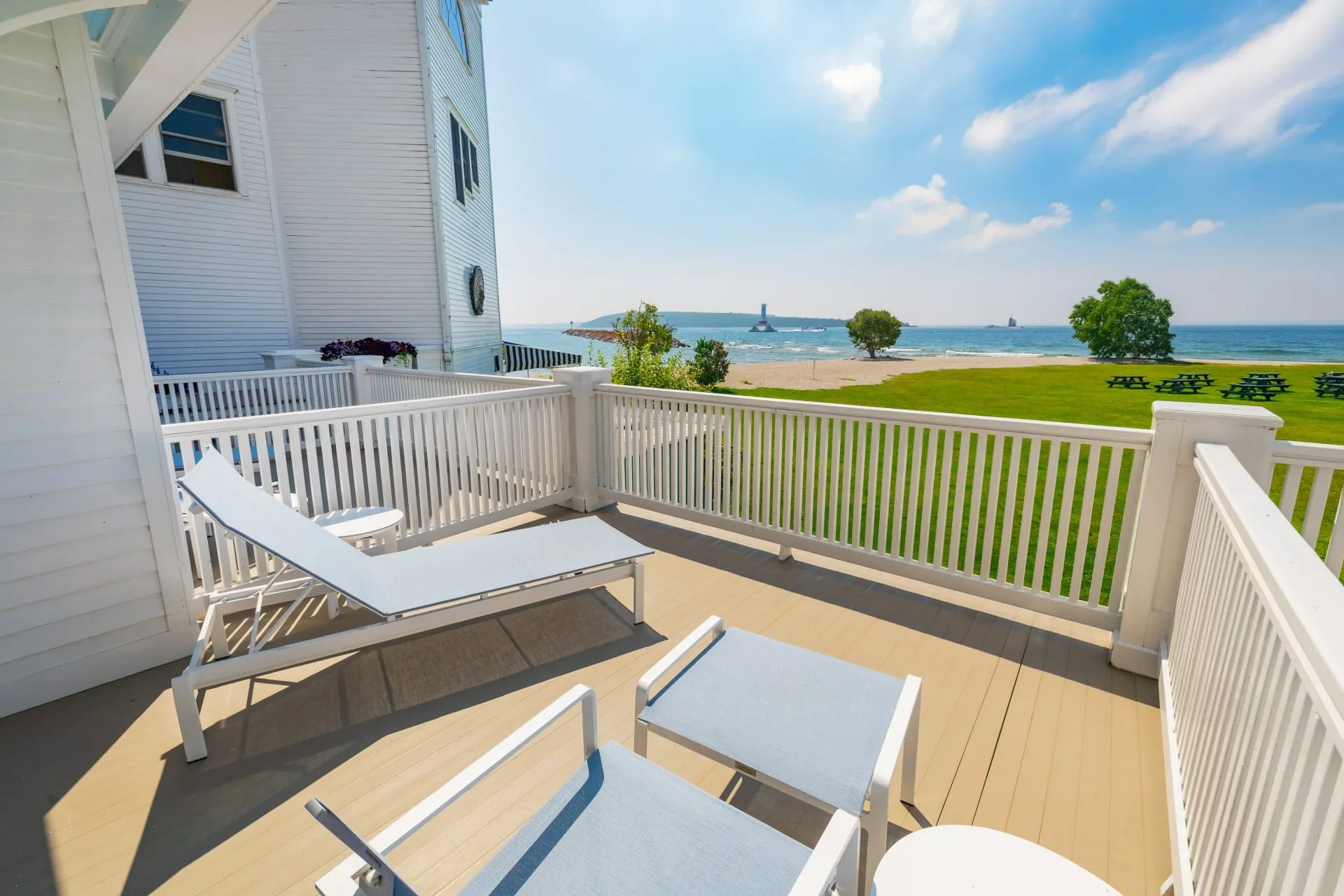 A balcony with lounging chairs looking out onto Lake Superior.